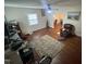 Living room with hardwood floors, area rug, ceiling fan, and view into adjacent room at 0 Chapel Hill Rd, Durham, NC 27707