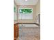 Modern bathroom featuring a soaking tub and travertine tile surround at 101 Collinson Dr, Chapel Hill, NC 27514