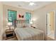 Bedroom with ceiling fan and two windows bringing in lots of natural light at 101 Collinson Dr, Chapel Hill, NC 27514