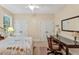 Neutral bedroom with carpet, ceiling fan, a desk and a large mirror at 101 Collinson Dr, Chapel Hill, NC 27514