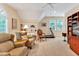 Spacious bonus room with vaulted ceiling, seating, and exercise equipment at 101 Collinson Dr, Chapel Hill, NC 27514