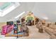 Large bonus room with high ceilings, skylight, and a music area at 101 Collinson Dr, Chapel Hill, NC 27514