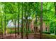 Beautiful brick home surrounded by mature trees, offering a serene and private setting at 101 Collinson Dr, Chapel Hill, NC 27514