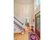 Grand foyer showcasing a hardwood staircase, high ceilings, and a glimpse into the adjacent living spaces at 101 Collinson Dr, Chapel Hill, NC 27514