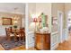 Entryway with hardwood floors leading into the dining room featuring classic decor and natural light at 101 Collinson Dr, Chapel Hill, NC 27514