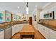Open kitchen features white cabinets, granite countertops, stainless steel appliances, and large wood butcher block island at 101 Collinson Dr, Chapel Hill, NC 27514