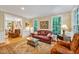 Inviting living room with a plush sofa, hardwood floors, and a view to the adjacent room at 101 Collinson Dr, Chapel Hill, NC 27514