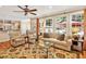Bright and airy living room with neutral tones, comfortable seating, and abundant natural light from large windows at 101 Collinson Dr, Chapel Hill, NC 27514