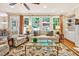 Bright living room with hardwood floors, large windows, and comfortable seating at 101 Collinson Dr, Chapel Hill, NC 27514