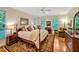 Cozy main bedroom featuring a plush bed, ceiling fan, and hardwood floors at 101 Collinson Dr, Chapel Hill, NC 27514