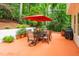 Outdoor patio area with dining table and lush greenery for relaxing or entertaining at 101 Collinson Dr, Chapel Hill, NC 27514