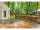 View of the back deck showing the natural light, access to the yard, and outdoor living space at 106 Ridgepath Way, Cary, NC 27511