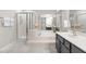 Bathroom boasts a shower, garden tub, and a vanity with grey cabinets providing storage at 106 Ridgepath Way, Cary, NC 27511