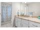 Bathroom with granite counters, white cabinets, and a shower with a decorative curtain at 106 Ridgepath Way, Cary, NC 27511