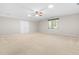 Spacious carpeted bedroom featuring a ceiling fan, recessed lighting, and double door closet at 106 Ridgepath Way, Cary, NC 27511
