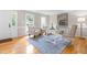 Bright home office with natural light, neutral walls, light blue rug, and hardwood floors at 106 Ridgepath Way, Cary, NC 27511