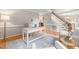 Spacious home office with desk, chairs, hardwood floors, and access to staircase at 106 Ridgepath Way, Cary, NC 27511