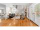 Open living room featuring hardwood floors, french doors and a cozy fireplace at 106 Ridgepath Way, Cary, NC 27511