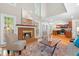 Inviting living room with brick fireplace, high ceilings, and hardwood floors at 106 Ridgepath Way, Cary, NC 27511