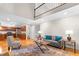 Bright living room features hardwood floors, a gray sofa with blue pillows, and a tall ceiling with a loft at 106 Ridgepath Way, Cary, NC 27511
