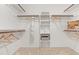 Spacious walk-in closet with built-in shelves and racks for optimized storage and organization at 106 Ridgepath Way, Cary, NC 27511