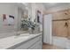 Bathroom featuring a granite vanity, a large mirror, and a shower and tub combo at 109 Henrys Ridge Rd, Pittsboro, NC 27312