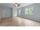 Bright bedroom with two windows, a closet, and light blue walls at 109 Henrys Ridge Rd, Pittsboro, NC 27312