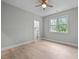 Bedroom featuring neutral walls, light wood flooring, and a walk-in closet at 109 Henrys Ridge Rd, Pittsboro, NC 27312