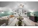 Vaulted living room with built-in shelving, a ceiling fan, and a large rug at 109 Henrys Ridge Rd, Pittsboro, NC 27312