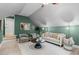 Open living room with hardwood floors, a decorative rug, and natural lighting at 109 Henrys Ridge Rd, Pittsboro, NC 27312