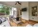 Inviting screened porch with ceiling fan, comfortable seating, and wood flooring for relaxing outdoors at 109 Henrys Ridge Rd, Pittsboro, NC 27312