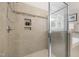 Walk in shower features neutral tiling, recessed shelf, and modern fixtures at 109 Henrys Ridge Rd, Pittsboro, NC 27312