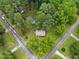 Aerial view showcases the property surrounded by lush trees and a charming neighborhood at 111 S Gaylee Lake Dr, Wendell, NC 27591