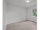 Bright bedroom with neutral walls, flooring, and window with wooded view at 111 S Gaylee Lake Dr, Wendell, NC 27591