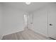Bright bedroom with neutral walls and flooring, with doorway to ensuite bathroom at 111 S Gaylee Lake Dr, Wendell, NC 27591