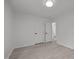 Bright bedroom with neutral walls and flooring, with doorway to ensuite bathroom at 111 S Gaylee Lake Dr, Wendell, NC 27591