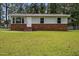 Charming single-story home with brick facade and well-maintained lawn at 111 S Gaylee Lake Dr, Wendell, NC 27591