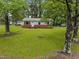 Charming one-story home with a brick foundation, a small front deck, and a beautifully maintained lawn at 111 S Gaylee Lake Dr, Wendell, NC 27591