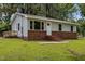 Charming single-story home featuring a brick foundation, updated windows, and a inviting front porch at 111 S Gaylee Lake Dr, Wendell, NC 27591