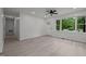 Bright living area with an open door, ceiling fan, and large window views at 111 S Gaylee Lake Dr, Wendell, NC 27591