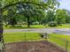 Scenic street view featuring lush green spaces and a tranquil pond setting at 111 S Gaylee Lake Dr, Wendell, NC 27591