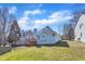 Backyard with green grass and house with stairs to deck at 11113 N Radner Way, Raleigh, NC 27613