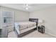 Bedroom with large window, ceiling fan, and neutral walls at 11113 N Radner Way, Raleigh, NC 27613