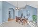 Dining room with natural light and hardwood floors leading to a dining table at 11113 N Radner Way, Raleigh, NC 27613