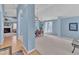 Spacious dining area with blue walls, carpeted floors, and view into the living room at 11113 N Radner Way, Raleigh, NC 27613