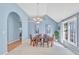 Bright dining room with large windows and stylish decor, perfect for Gathering gatherings at 11113 N Radner Way, Raleigh, NC 27613