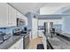 Modern kitchen with stainless steel appliances, granite countertops, and ample cabinet space at 11113 N Radner Way, Raleigh, NC 27613