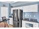 The kitchen is updated with stainless appliances, granite counters, and a breakfast bar at 11113 N Radner Way, Raleigh, NC 27613