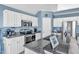 Well-equipped kitchen with modern appliances, granite countertops, and white cabinetry at 11113 N Radner Way, Raleigh, NC 27613