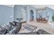 Inviting living room featuring a comfortable black leather sofa and stylish coffee table at 11113 N Radner Way, Raleigh, NC 27613
